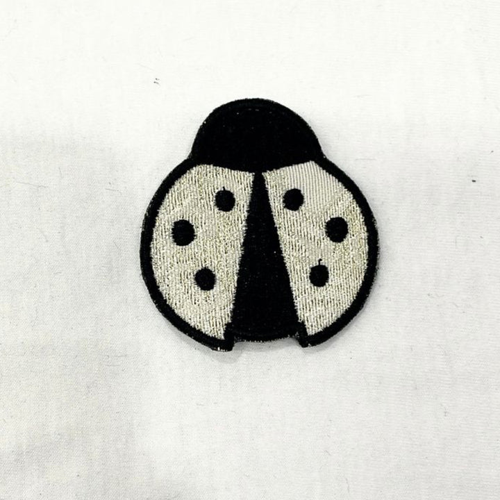 PIN LADYBUG BEIGE